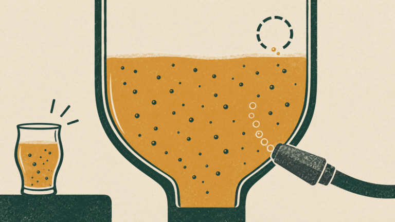 A sample glass beside a tank detail, with existing bubble motifs and a small stream entering through a carbonation stone.
